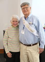 Sid Jones poses for a photo with his wife 