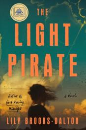 Book Cover. The Light Pirate in large orange text. A painterly image of a girl standing in front of a background of sky and large clouds. 