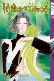 A man with chin length hair and red eyes holds a mermaid with blonde hair and sharp claws