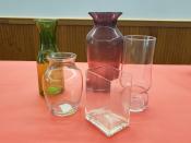 purple, green and clear vases in different sizes and shapes