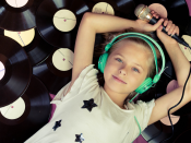 Child with microphone and vinyl records Child with microphone and vinyl records